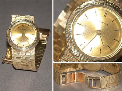 Lot 27 - Lady's Gold Wristwatch The 14 kt. yellow gold...