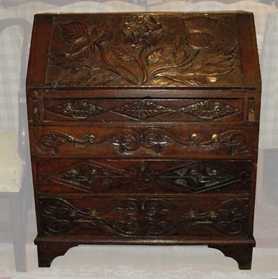 Lot 1482 - Provincial George III Style Carved Oak Slant...
