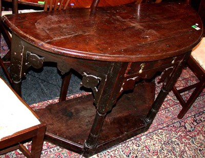 Lot 142 - Jacobean Oak Side Table The demilune top above...