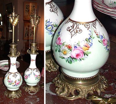 Lot 202 - Pair of French Porcelain and Gilt-Metal Lamps