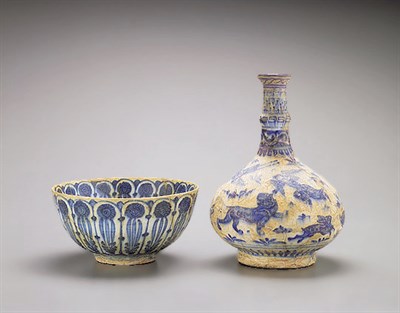 Lot 1 - PERSIAN BLUE AND WHITE POTTERY BOTTLE VASE AND...
