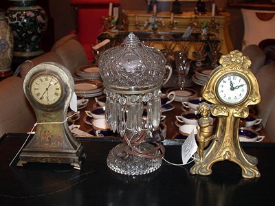 Lot 310 - Two Patinated-Metal Clocks Together with a...