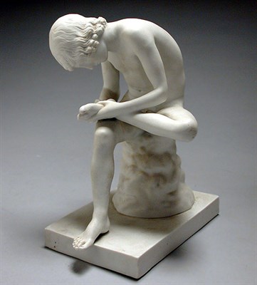 Lot 602 - Bisque Figure of a Seated Boy The figure...