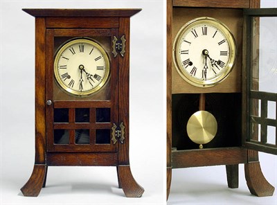 Lot 264 - Arts and Crafts Oak Clock
