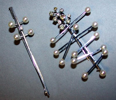 Lot 94 - Two Cultured Pearl and Diamond Pins 18 kt....