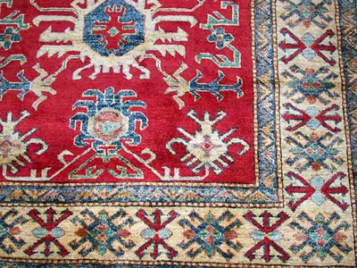 Lot 557 - Peshawar Rug Pakistan, contemporary The madder...