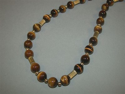 Lot 77 - Tiger's-Eye and Gold Necklace
