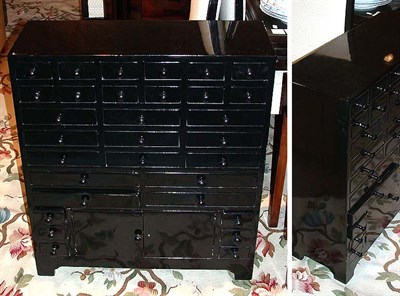 Lot 147 - Pair of Black Lacquered Multi-Drawer Side...