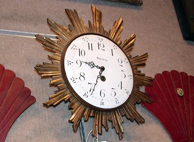 Lot 408 - Continental Enamel and Gilt-Metal Sunburst Clock