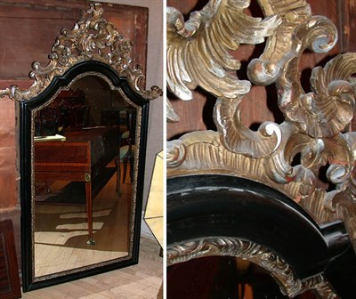 Lot 250 - Baroque Style Parcel Gilt Ebonized Mirror