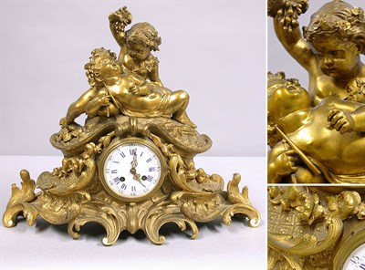 Lot 400 - Louis XV Style Gilt-Bronze Clock Cast as two...