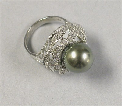 Lot 456 - Black Pearl and Diamond Cluster Ring