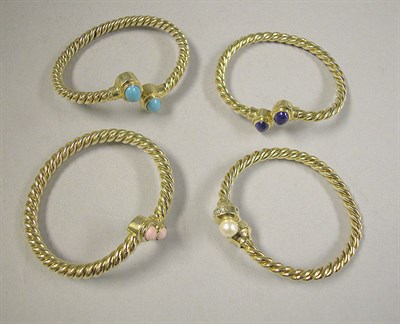 Lot 322 - Four Twisted Wire Bangles