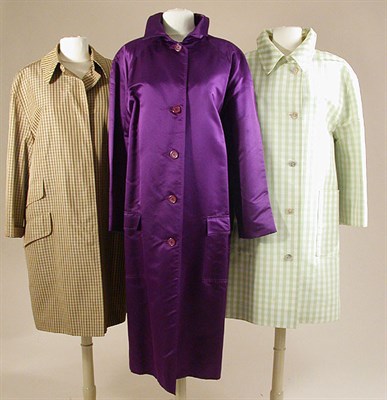 Lot 671 - Three Bill Blass Raincoats American, circa...