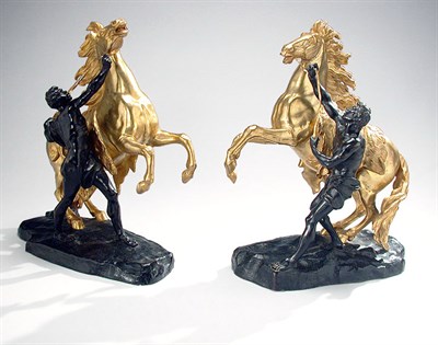 Lot 302 - Pair of Gilt and Patinated-Bronze Figures of...