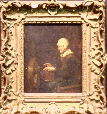 Lot 97 - Manner of Gabriel Metsu WOMAN AT THE SPINNING...