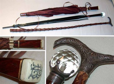 Lot 516 - Two Umbrellas and a Cane