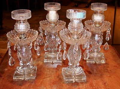 Lot 212 - Set of Four Colorless Cut Glass Candlesticks