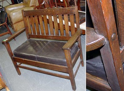Lot 1175 - Mission Oak Settee The slatted back over an...