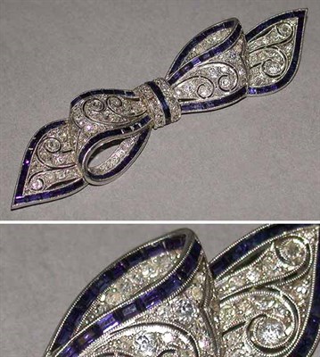 Lot 456 - Diamond and Synthetic Sapphire Bow Pin