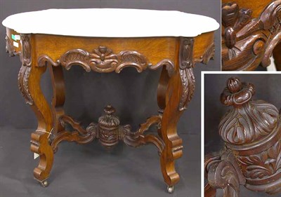 Lot 145 - Rococo Revival Walnut Center Table The shaped...