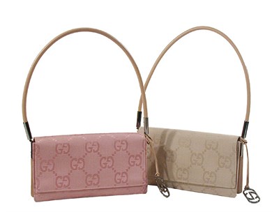 Lot 2306 - Two Gucci Canvas Logo Bags Italian, 1990s The...