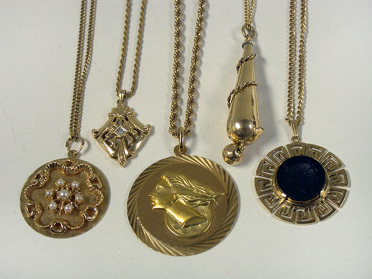 Lot 307 - Five Assorted Gold Pendants and Chains