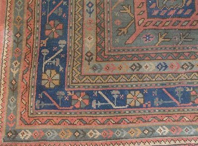Lot 273 - Oushak Carpet The central polychrome pendant...