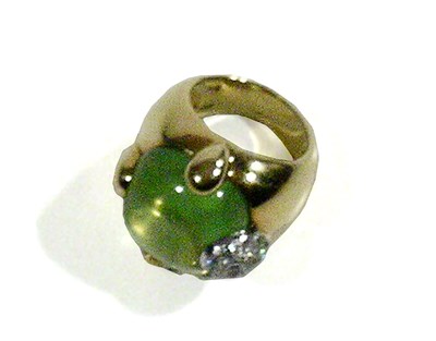 Lot 2373 - Pomellato 18 Kt. Gold Peridot Ring The wide...