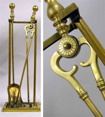 Lot 67 - Two Brass Fire Tools and Stand