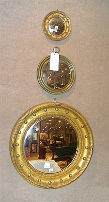 Lot 221 - Two Gilt-Wood Framed Convex Mirrors Each hung...