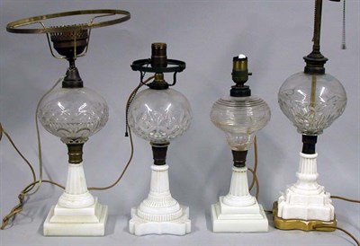 Lot 120 - Group of Four Glass Fluid Lamps Each raised on...