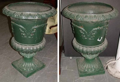 Lot 162 - Pair of Cast Iron Urns Each of campana form....