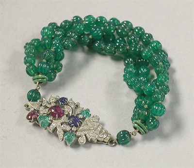 Lot 417 - Diamond and Multicolored Stone Combination Clip/Clasp and Onyx Bead Bracelet