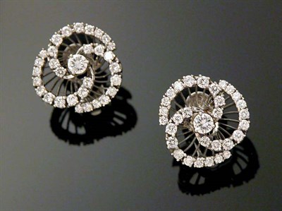 Lot 624 - Pair of Diamond Swirl Earclips Platinum, set...