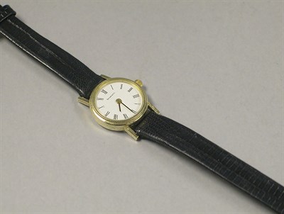 Lot 323 - Lady's Gold Wristwatch The leather band...