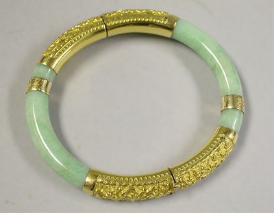 Lot 274 - Jade and Gold Bangle Bracelet