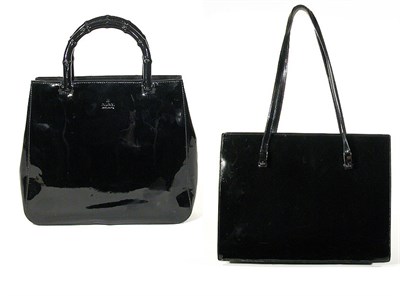 Lot 3777 - Two Gucci Black Leather Handbags One patent...