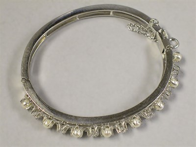 Lot 400 - Diamond and Cultured Pearl Bangle Bracelet