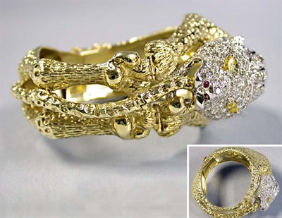 Lot 593 - Gold and Diamond Lion Bangle