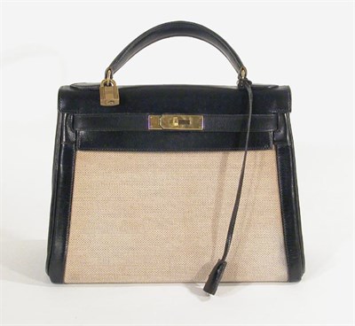 Lot 3747 - Hermes Toile-H Canvas and Black Leather Trim...