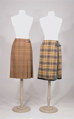 Lot 3569 - Two Plaid Wool Hermes Skirts with Leather Trim...