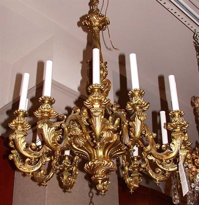 Lot 2386 - Louis XV Style Brass Twelve-Light Chandelier...