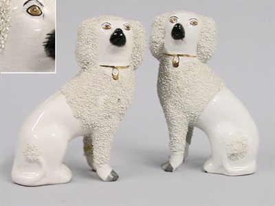 Lot 2230 - Pair of Staffordshire Slip-Ware Spaniels
