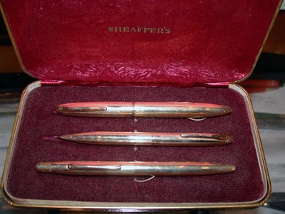 Lot 2273 - Sheaffer 14k Gold Three-Piece Pen and Pencil...