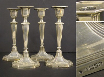 Lot 2830 - Set of Four Modern English Silver Candlesticks...