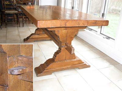Lot 3136 - Rustic Oak Trestle Table The rectangular top...