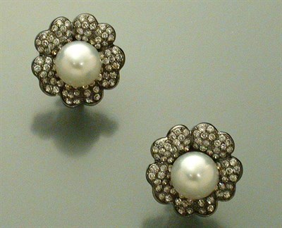 Lot 477 - Pair of Cultured Pearl and Diamond Flower Earrings