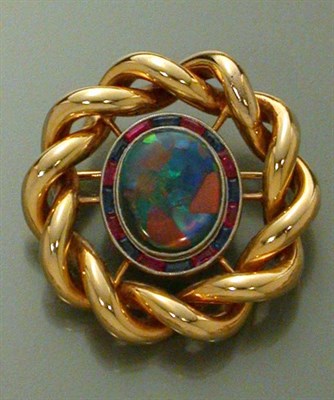 Lot 453 - Gold, Black Opal, Ruby and Sapphire Pin