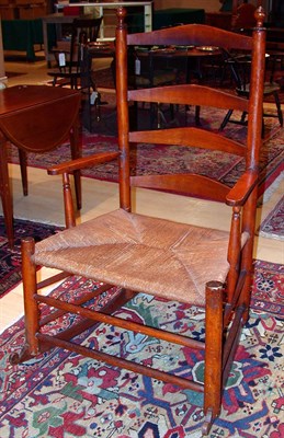 Lot 2115 - Slat Back Rush Seat Rocking Armchair 19th...